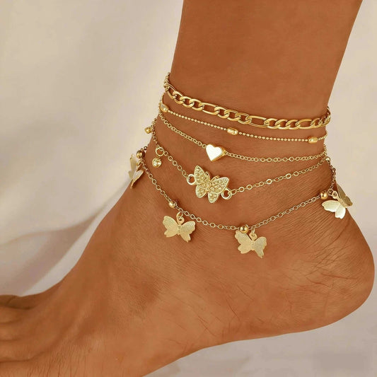 Gold Butterfly Anklet Set with 4-layer stackable gold ankle bracelets featuring butterfly charm for women