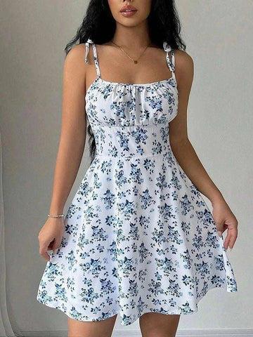 Women's summer floral spaghetti strap beach short dress on model